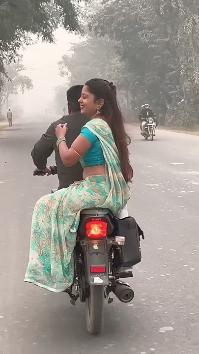Hot girl going on bike in road