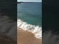Waves crashing on a beach in Hawaii.