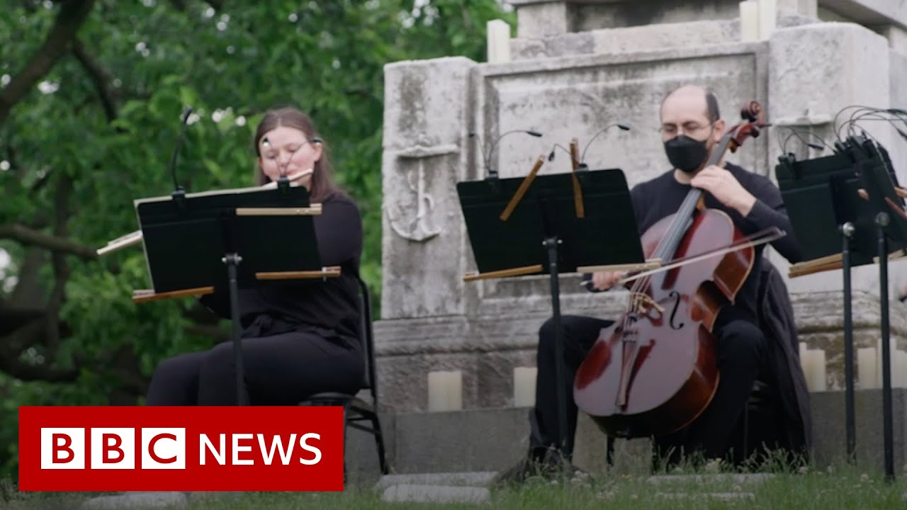 The New York Philharmonic playing at a cemetery - BBC News