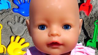 Polina Playing With Dolls And Sand Molds On The Beach.