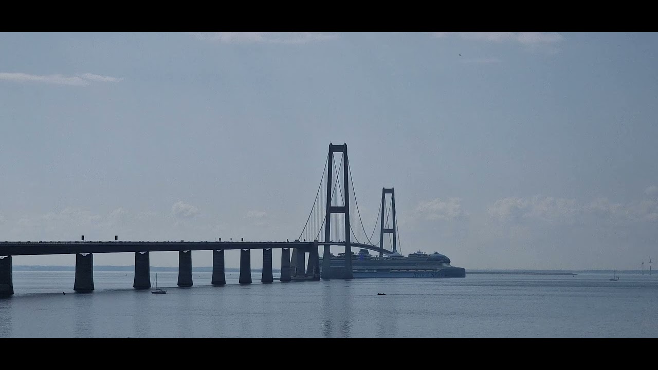 Star of the Seas passing under the Great Belt Bridge in Denmark
