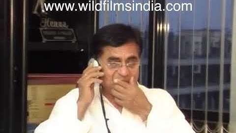Jagjit Singh speaks on the phone and gives instructions - candid moments before an interview at home