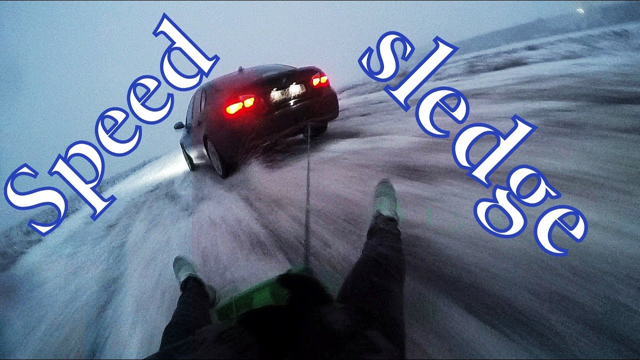 BMW snow drifting while towing a sledge