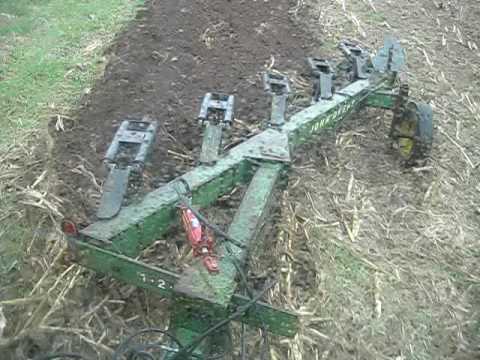 Plowing with a John Deere 4440, pulling a John Deere 2600 5 bottom mouldboard plow next to Lyon Brook - April 23, 2009 at Miry Run Farm in Oxford, New York.