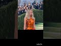 kim kardashian sporting a tangerine fiberglass breastplate that wasfinished in an auto body shop.