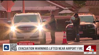 Evacuation warnings lifted near Airport Fire as crews make progress