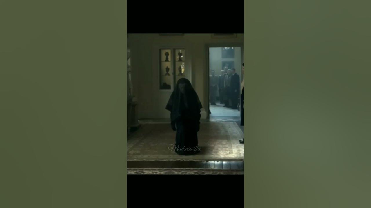 Queen Mary bowing to Queen Elizabeth II scene from The Crown