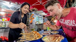 Cute Indonesian girl challenges me to eat 100 SPICY Sate 🇮🇩