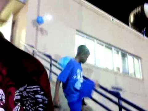 kid beats balloons