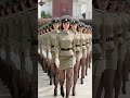 Female soldiers in khaki uniforms march in perfect sync, powerful display!