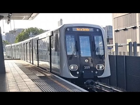 DLR B23 Stock arrives and departs Custom House - YouTube