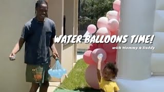 Stormi & Travis Scott Play Water Balloons