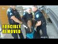 5 Officers Spend Over an Hour Trying to Remove Homeless Woman from Building