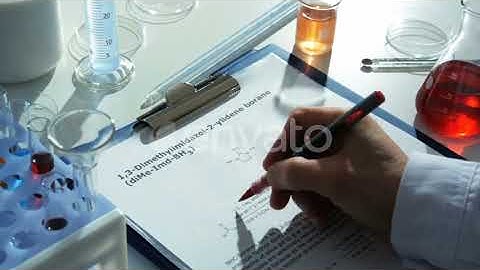 Chemistry Lab - Researcher Writes Results of His Experiment Down | Stock Footage - Envato elements