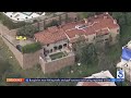 Police swarm Beverly Crest mansion occupied by squatters