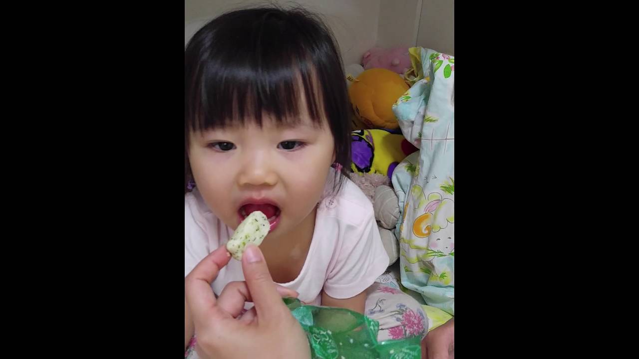 Baby girl eating wasabi rice crunchy snack YouTube