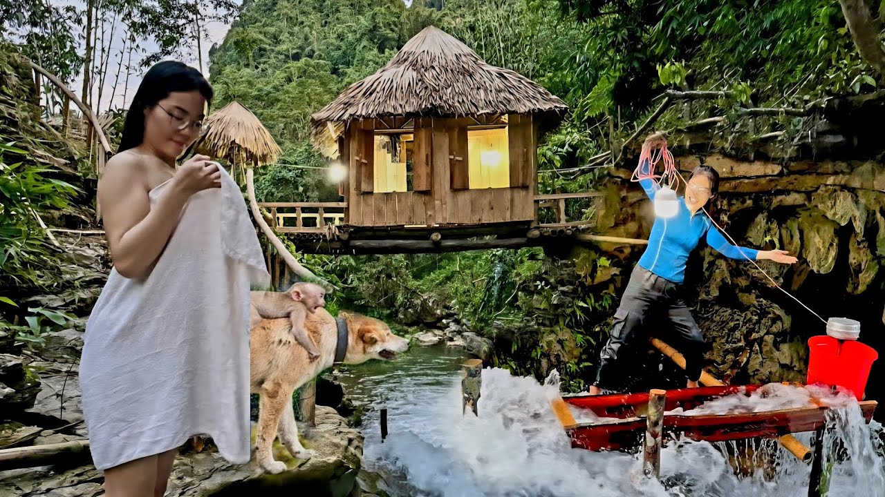 The girl built a mini generator on a small stream with a powerful engine