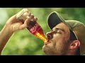 Trying to Chung a Coca-Cola bottle Trying not to burp