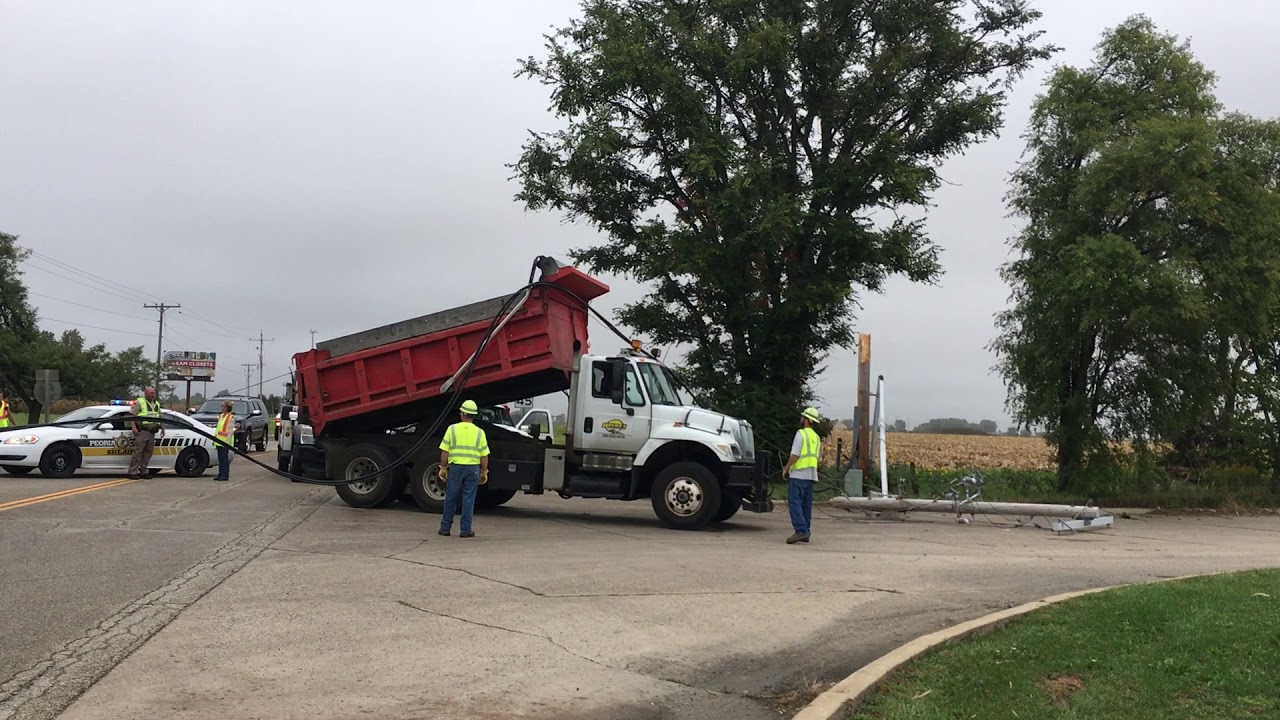 Dump truck caught under power line in Edwards - YouTube