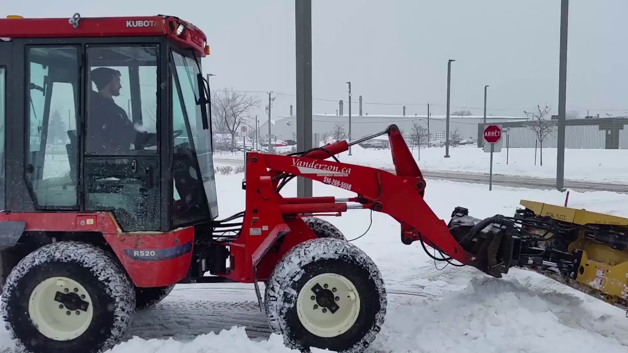 Kubota 520 with Metal Pless PlowMaxx 630-11 detailing sidewalks