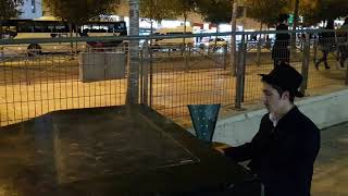 Hasid Habad Plays The Piano Near The Central Bus Station In Jerusalem.