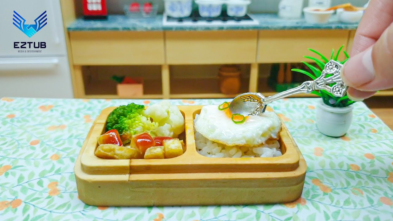Production Way Rice Box With Fried Egg And Fried Tofu With Vegetables