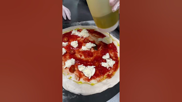 Making a delicious wood-fired pizza with fresh mozzarella, marinara and basil! #shorts