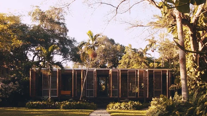 Wooden shutters swing open to reveal Miami house b...