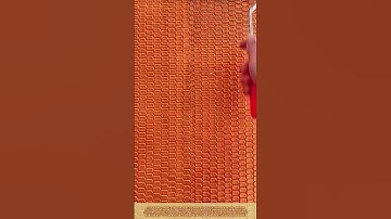 Best method of textured wall plastering: Skilled worker use patterned roller and create a 3D effect