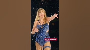 Taylor Swift posing for Travis Kelce on stage during Mastermind on the Eras Tour...