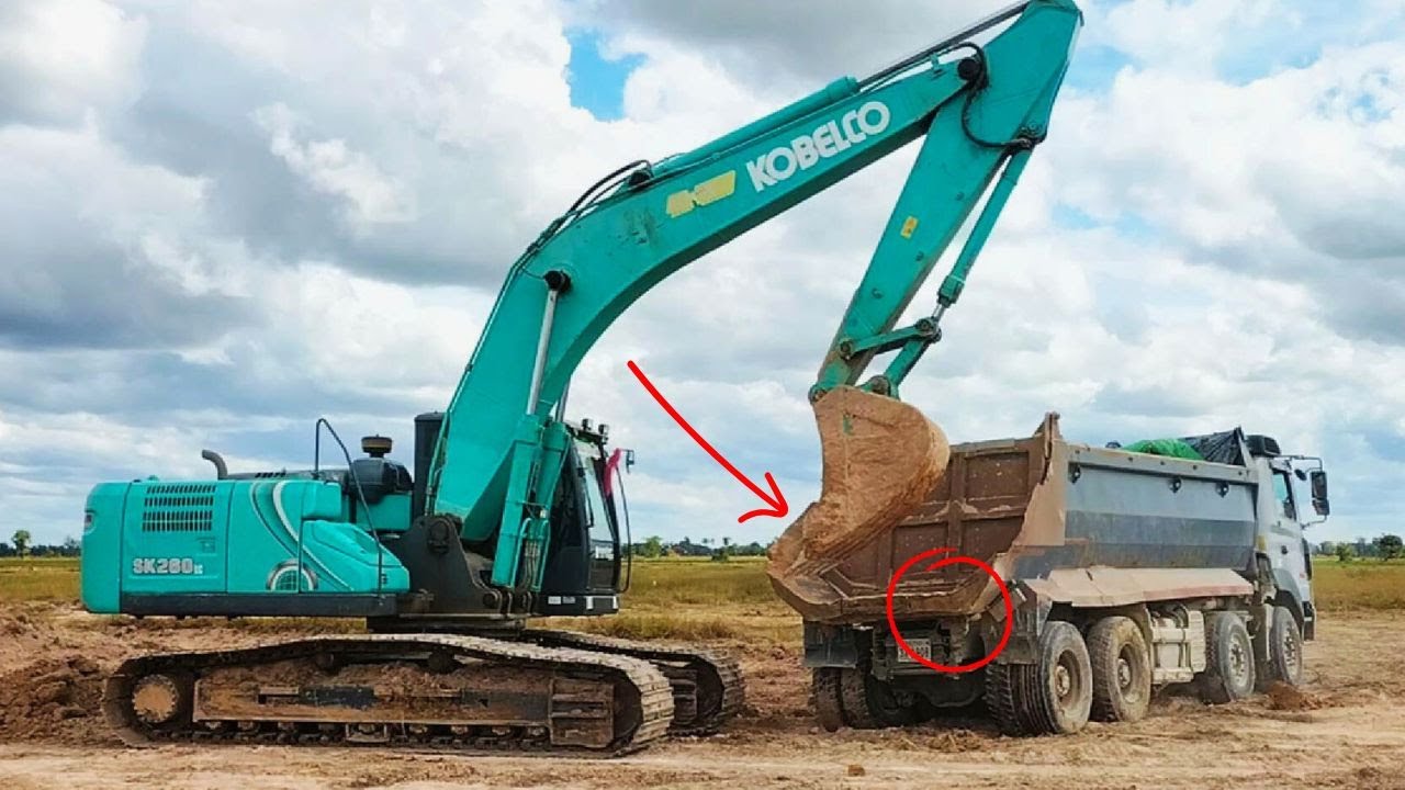 Excavator Loading Dump Truck | Heavy Equipment Working in the Field