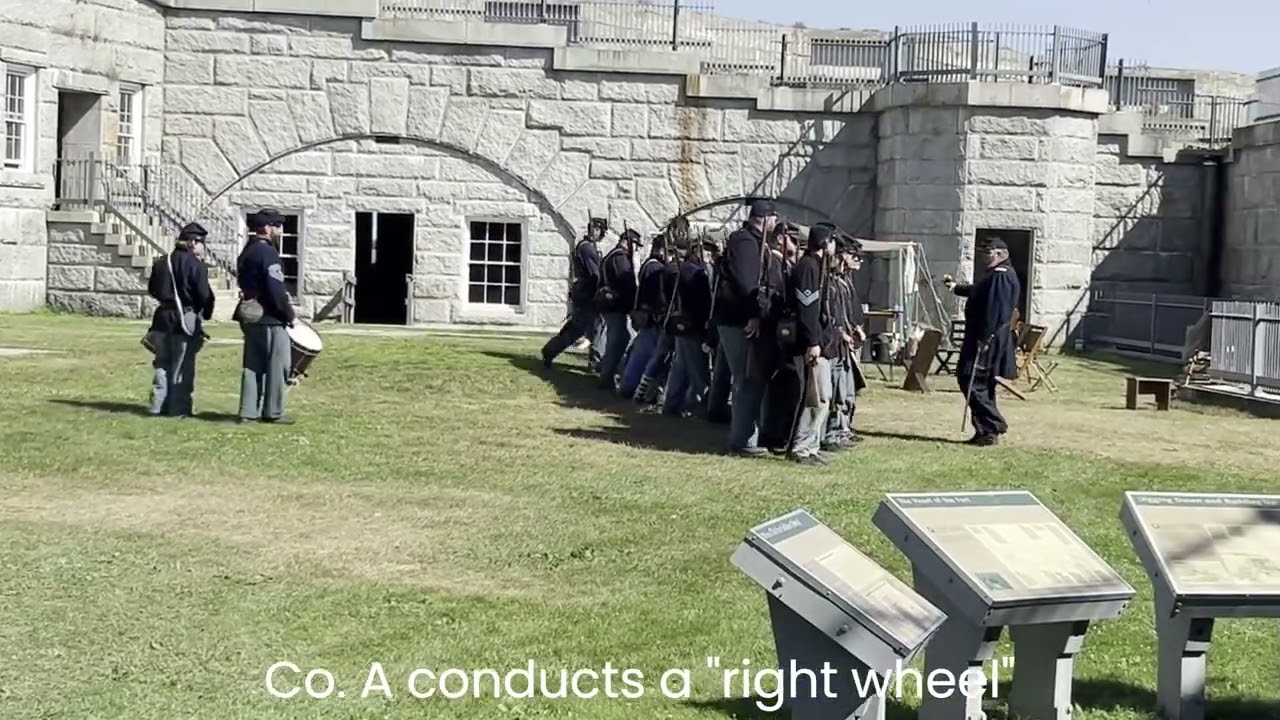 Civil War re-enactors practice close-order infantry drill at historic fort