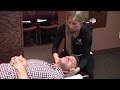 Spinal adjustment back pain treatment at west end chiropractic female doctor male patient