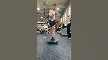 SL skater squat with rotation on BOSU ball