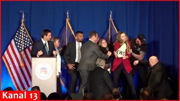 MOMENT: Two protesters rush stage during DeSantis speech in New Hampshire