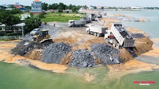 Efficient transportation of stones to a deep lake using exceptional road construction wheel loader!