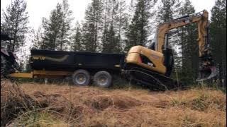 Loading Cat 307D on traktor trailer