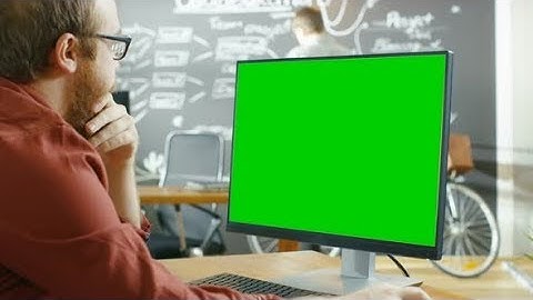 Man Works on the Personal Computer with Green Mock-up Screen | Stock Footage - Videohive