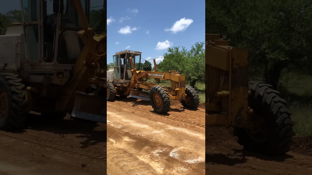 Mitsubishi Motor Grader Performing Modern Road Construction | 