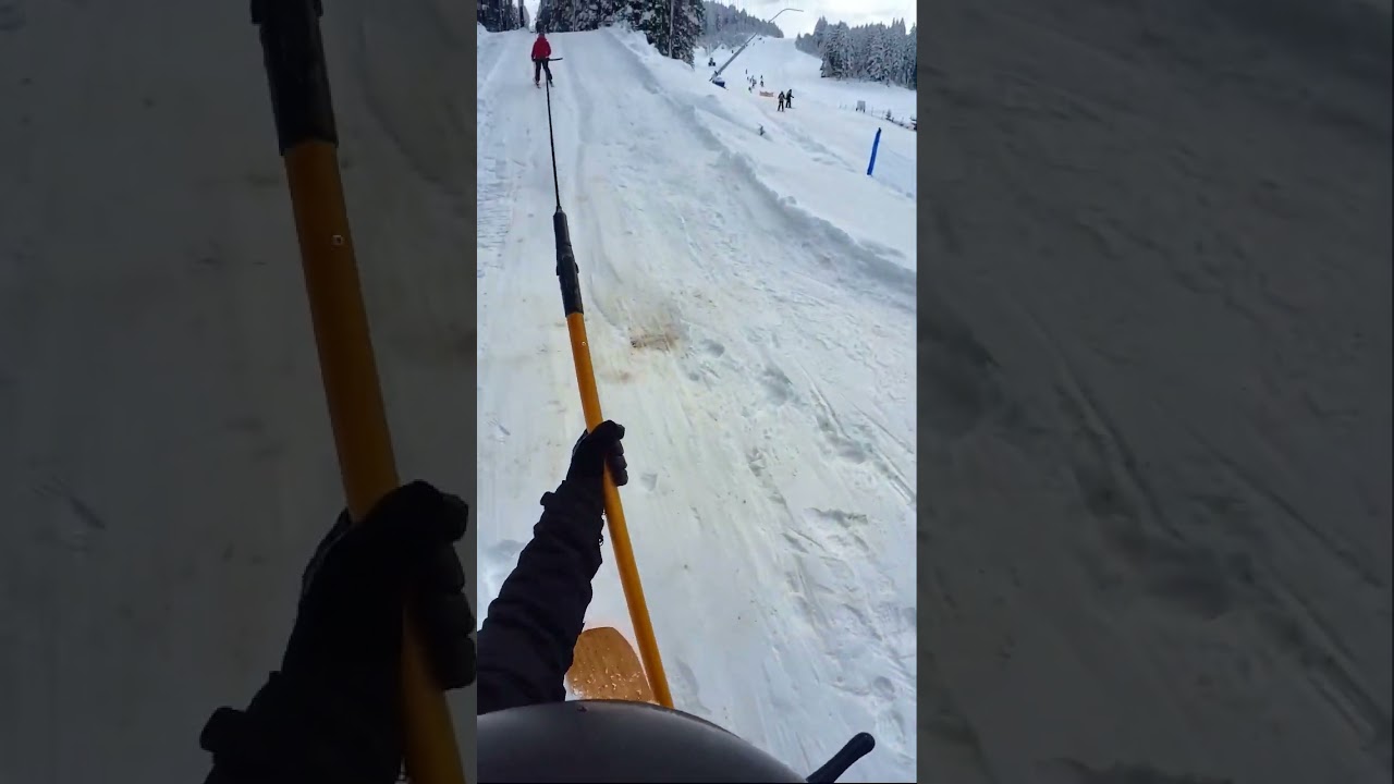 How to ride a t-bar ski lift on a snowboard - Beginner snowboarding tutorial 
