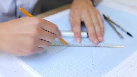 Engineer Drawing On Graph Paper Stock Video