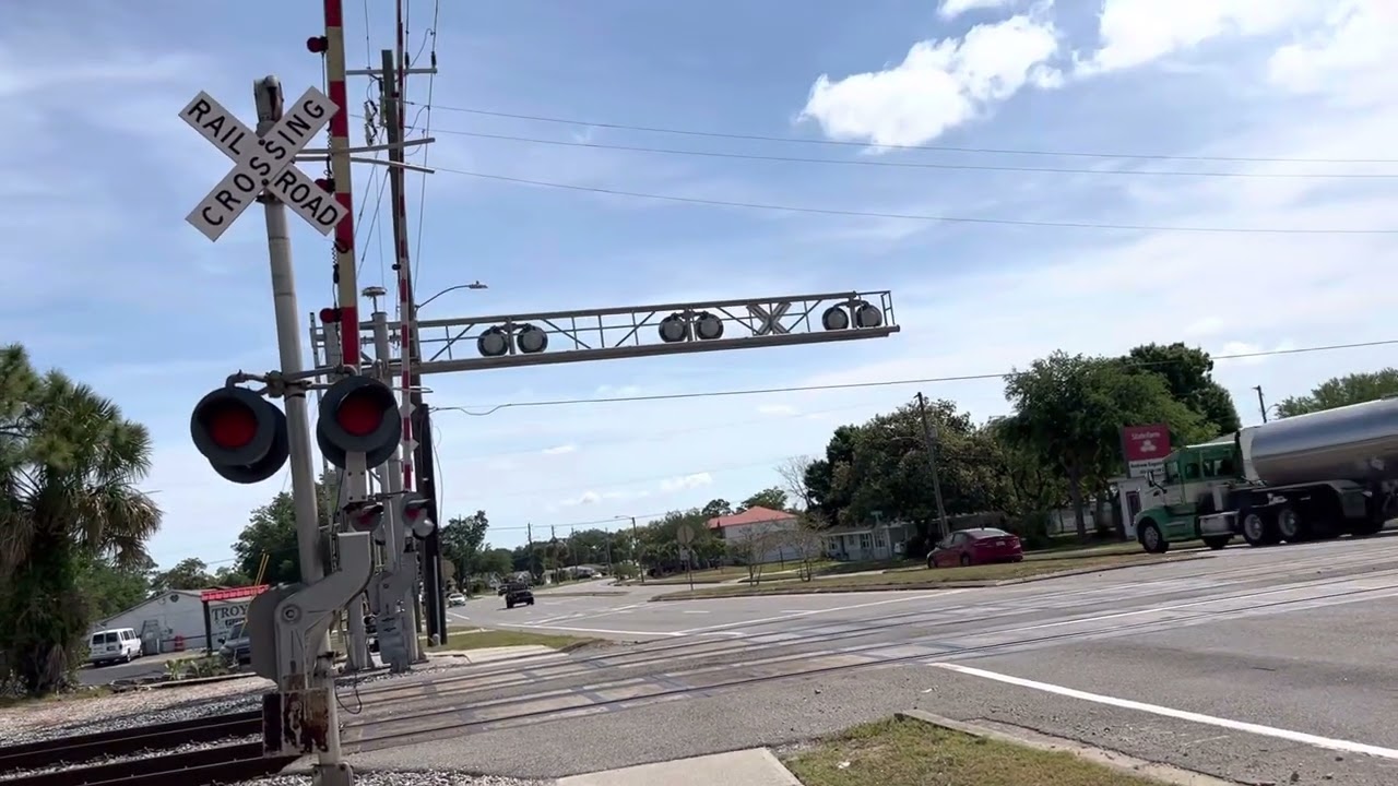 FEC Local train 915 NB slowly crossing Fay Blvd ( 431 leading )