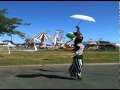 Circus Carnival Stilt Walker doing tricks ribbons and props