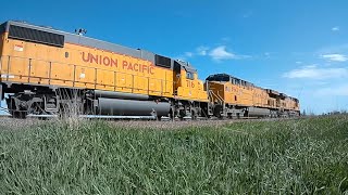 4 UP Locomotives with hopper cars & tanker cars traveling through Elkhart, Iowa