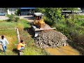 Amazing making foundation new road crossing water by skill operator komatsu d31 dozer moving stone