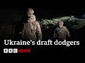 Ukrainian men flee draft in their thousands - BBC News