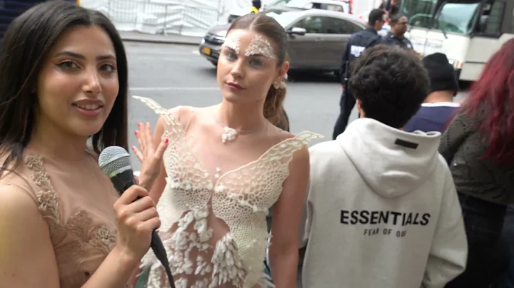 MET Gala 2024 interviews in front of red carpet designer studio.bor with pretty model