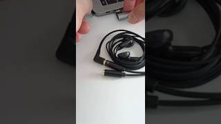 Plug the USB-C adapter into the Macbook after connecting the splitter and mic-less earphones shorts