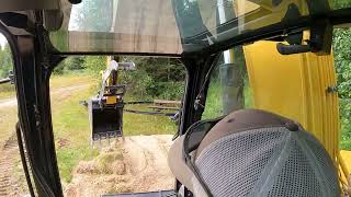 CLEARING JOB IS DONE AND THE CAT 307 5 IS OFF TO THE NEXT JOB