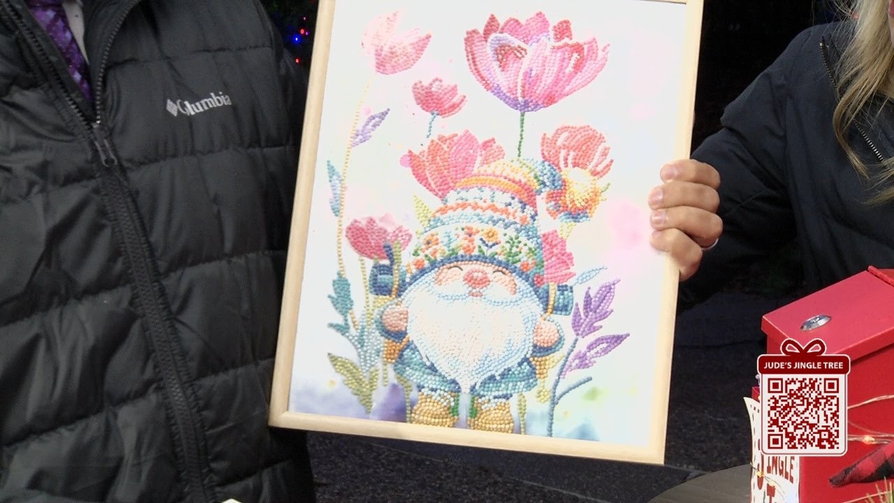 Bryce, Lindsay, and Jude receive artwork and baked goods for the Jingle Tree